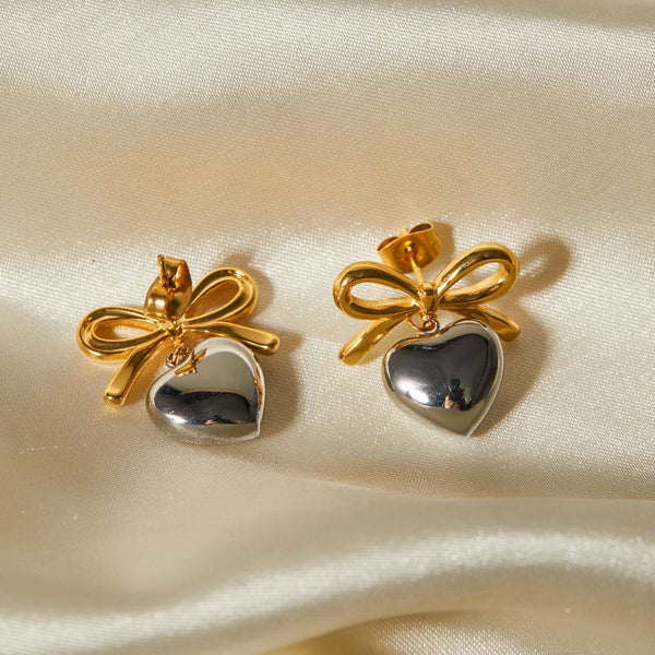 Aretes con diseño de moño y corazón