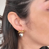 Aretes con diseño de moño y corazón